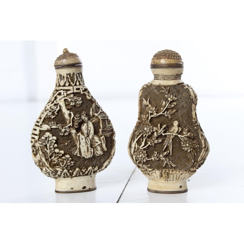 262 - A pair of 2 carved Oriental/ Chinese bottles, signed to base.