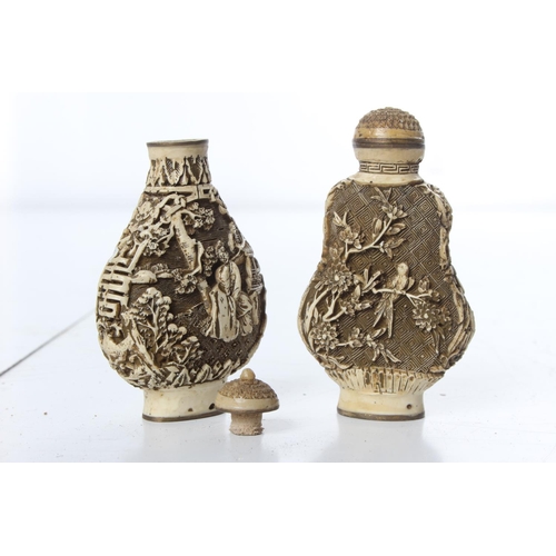 262 - A pair of 2 carved Oriental/ Chinese bottles, signed to base.