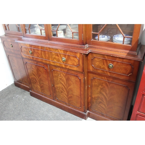 297 - A modern bookcase bureau, with decorative glass doors, measuring 15x78x71inches.