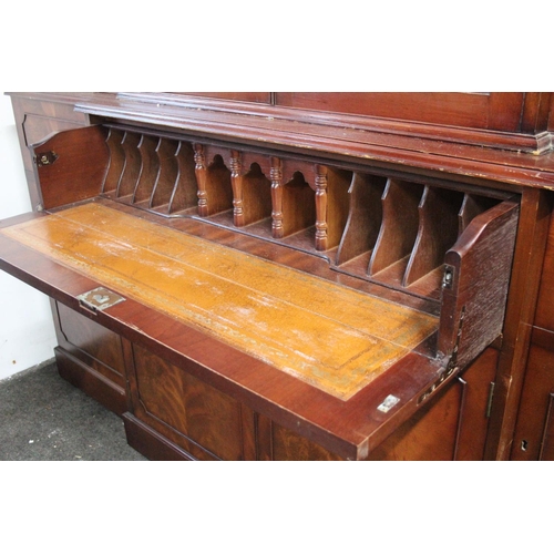 297 - A modern bookcase bureau, with decorative glass doors, measuring 15x78x71inches.