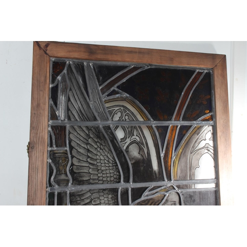 310 - A stunning antique stained leaded glass window panel, with trumpeting angel, measuring 22.5x38inches... 