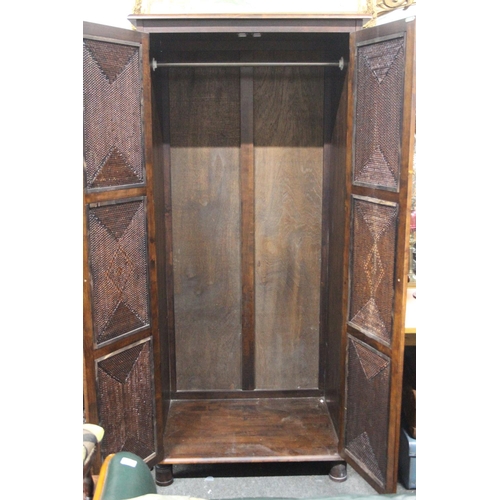 323 - A large modern double rattan wardrobe. 35.5x75.5x23.5inches.