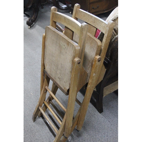 335 - A pair of vintage folding Church chairs, with 'Cross' cut out to splats.