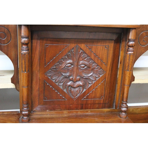 449B - An antique mahogany hall stand with mask head carving detail and original drip trays. Measuring appr... 