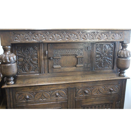 496 - A stunning large antique Court Cabinet/ press, with highly carved decorative panels. Measures 18x48x... 