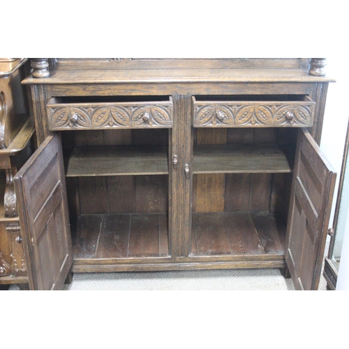 496 - A stunning large antique Court Cabinet/ press, with highly carved decorative panels. Measures 18x48x... 