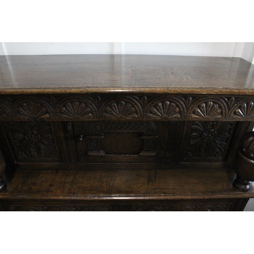 496 - A stunning large antique Court Cabinet/ press, with highly carved decorative panels. Measures 18x48x... 