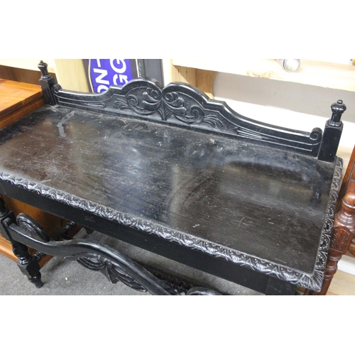 512 - A stunning antique oak ebonised table with gallery back. Measuring approx 48x19.5x38.5inches.