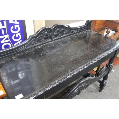 512 - A stunning antique oak ebonised table with gallery back. Measuring approx 48x19.5x38.5inches.