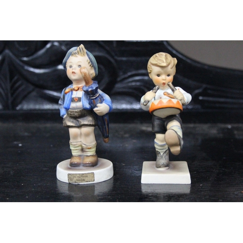 515 - Two Goebel Hummel figures 'Little Drummer Boy' and 'Home from Market'.