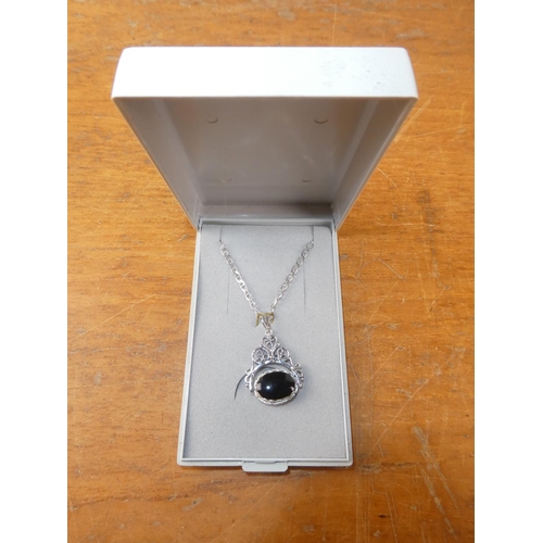 101 - A sterling silver double sided fob pendant on chain.