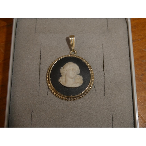 105 - A Sterling Silver Wade Porcelain pendant.