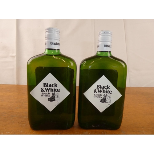 117 - Two bottles of Black & White Scottish Whisky, 13 1/3 fl.oz .