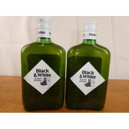 122 - Two bottles of Black & White Scottish Whisky, 13 1/3 fl.oz.