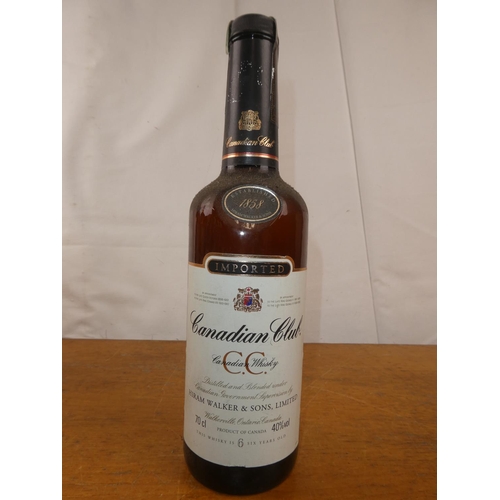 126 - A bottle of vintage Canadian Club Whisky, 70cl.