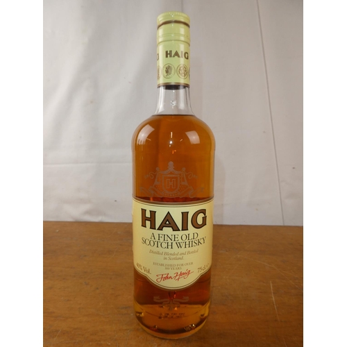 127 - A vintage bottle of Haig Scottish Whisky, 75cl.