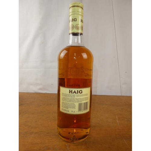 127 - A vintage bottle of Haig Scottish Whisky, 75cl.