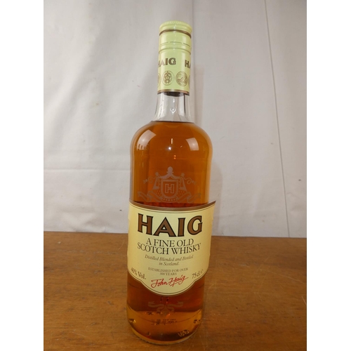 128 - A vintage bottle of Haig Scottish Whisky, 75cl.