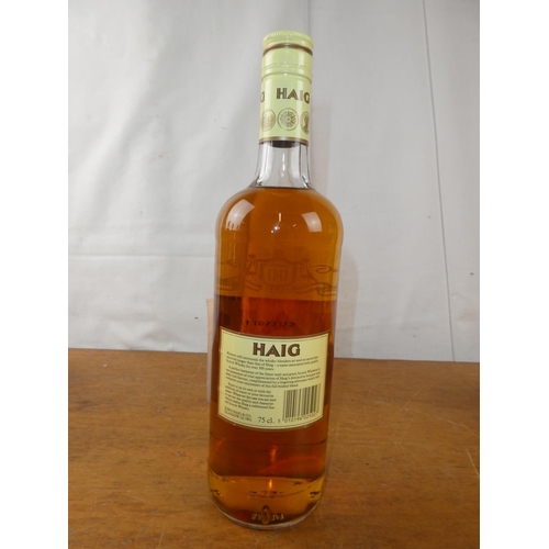 128 - A vintage bottle of Haig Scottish Whisky, 75cl.