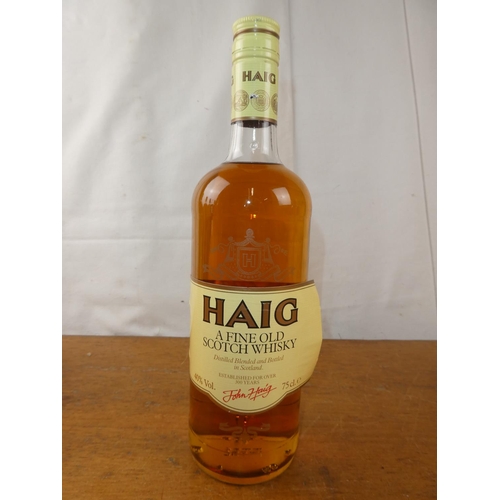 129 - A vintage bottle of Haig Scottish Whisky, 75cl.