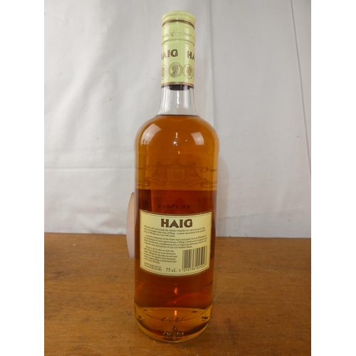 129 - A vintage bottle of Haig Scottish Whisky, 75cl.