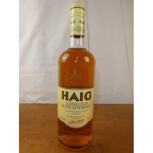 130 - A vintage bottle of Haig Scottish Whisky, 75cl.