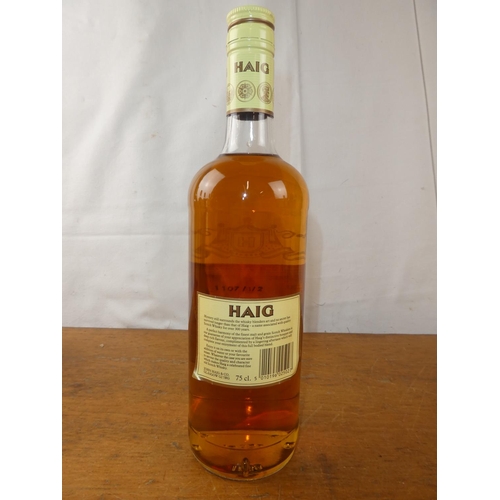 130 - A vintage bottle of Haig Scottish Whisky, 75cl.