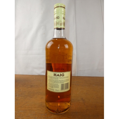 131 - A vintage bottle of Haig Scottish Whisky, 75cl.