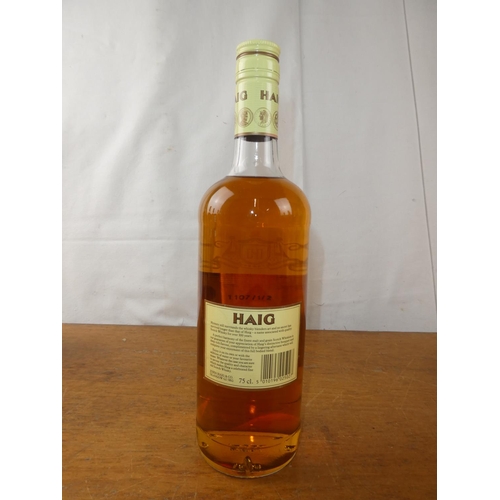 132 - A vintage bottle of Haig Scottish Whisky, 75cl.