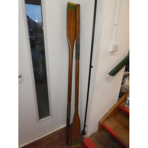 134 - A pair of vintage wooden oars.