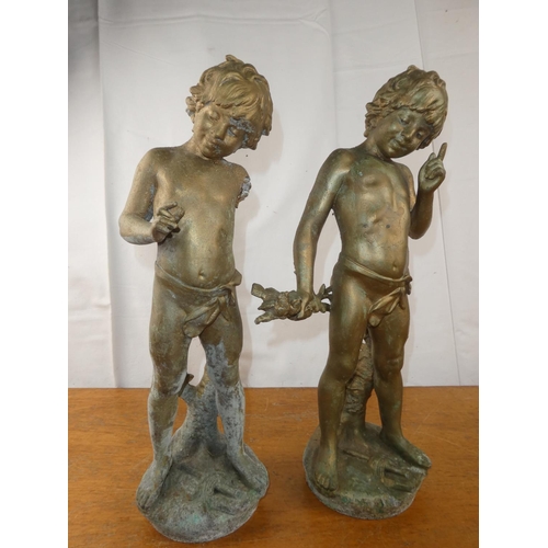 136 - A pair of brass cherubs. 19 inch height x 7.5 inch length.