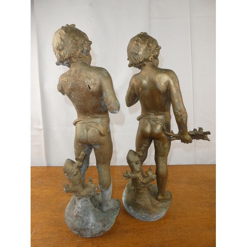 136 - A pair of brass cherubs. 19 inch height x 7.5 inch length.