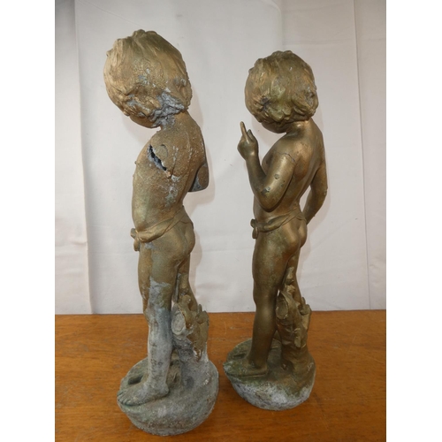 136 - A pair of brass cherubs. 19 inch height x 7.5 inch length.