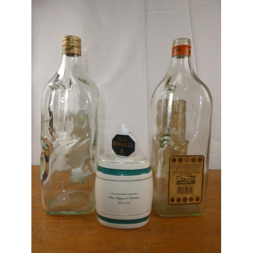 141 - Two large vintage Old Bushmills Whisky bottles and a vintage 'Sherry' decanter.