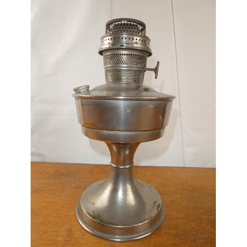 156 - A vintage metal based oil lamp.