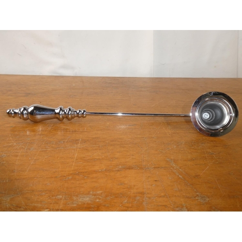 185 - A candle snuffer.