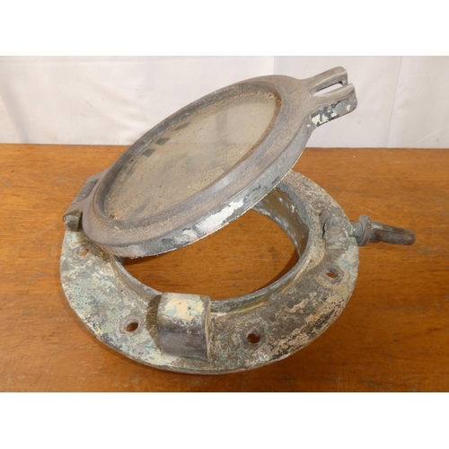 187 - An antique porthole. 12 inch height x  x 4.5 inch width