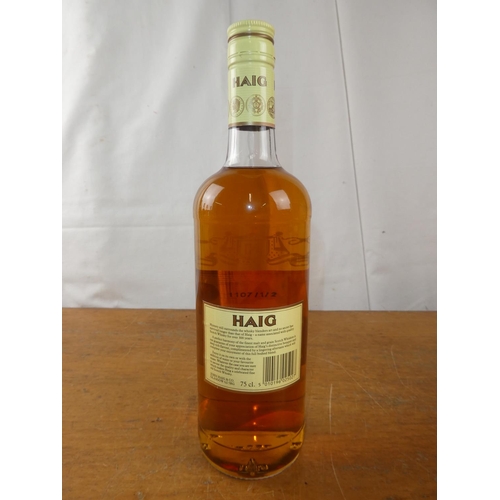 194 - A vintage bottle of Haig Scottish Whisky, 75cl.