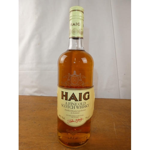 195 - A vintage bottle of Haig Scottish Whisky, 75cl.