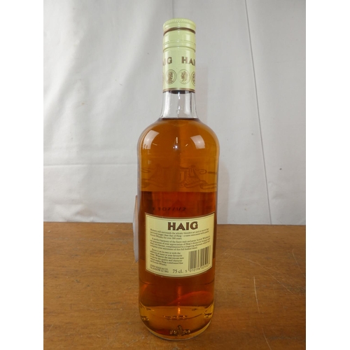 195 - A vintage bottle of Haig Scottish Whisky, 75cl.