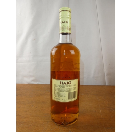 197 - A vintage bottle of Haig Scottish Whisky, 75cl.