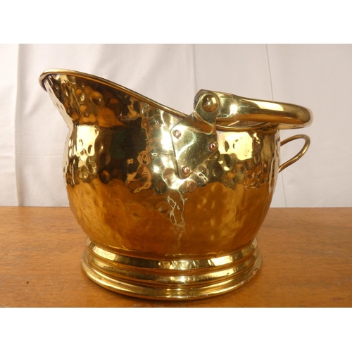 198 - An antique brass helmet coal bucket.