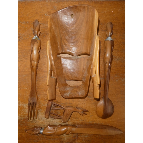 199 - A vintage wooden wall mask, utensils and a figure of a deer.