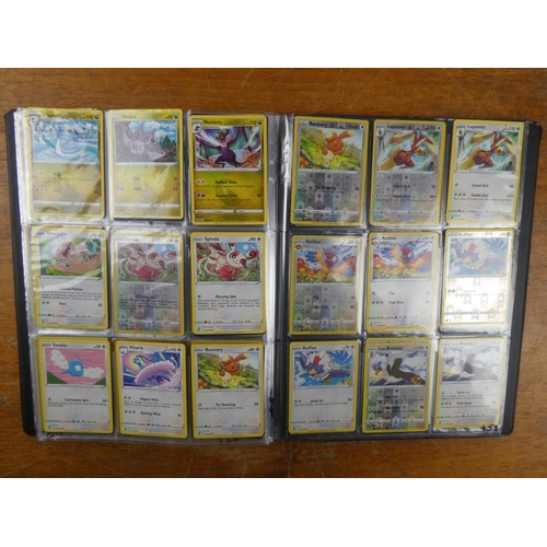 87 - A Pokemon album containing approximately 180 cards to include Holos and more.