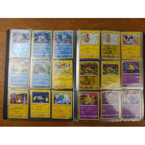 87 - A Pokemon album containing approximately 180 cards to include Holos and more.