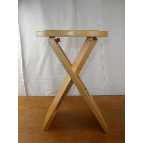 217 - A folding Suzy Stool by Adrian Reed.