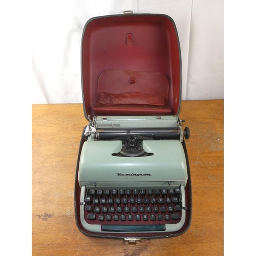 221 - A vintage cased Remington typewriter