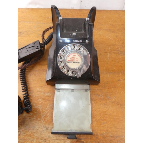 222 - A vintage bakelite rotary dial telephone (a/f).