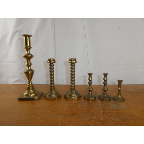 226 - Two pairs of vintage brass candlesticks and more.