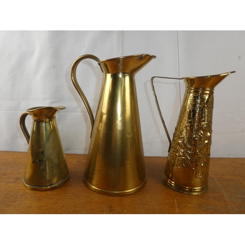 252 - A pair of vintage J S & S brass water jugs and another.